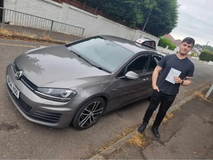 Callum after a first-time driving test pass with Bravo's