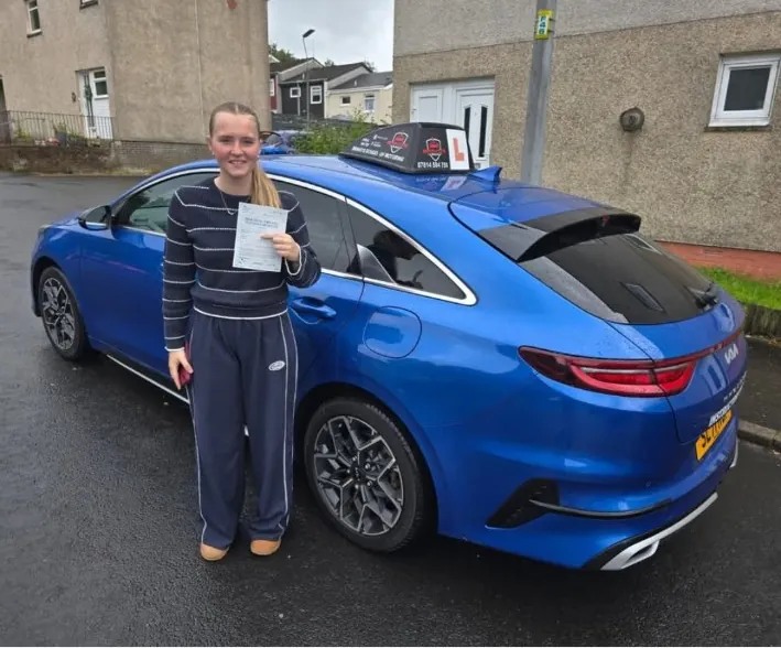 Katelyn after passing her driving test with Bravo's