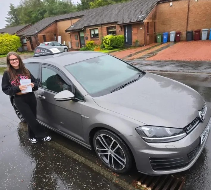 Leah after a first-time driving test pass with Bravo's