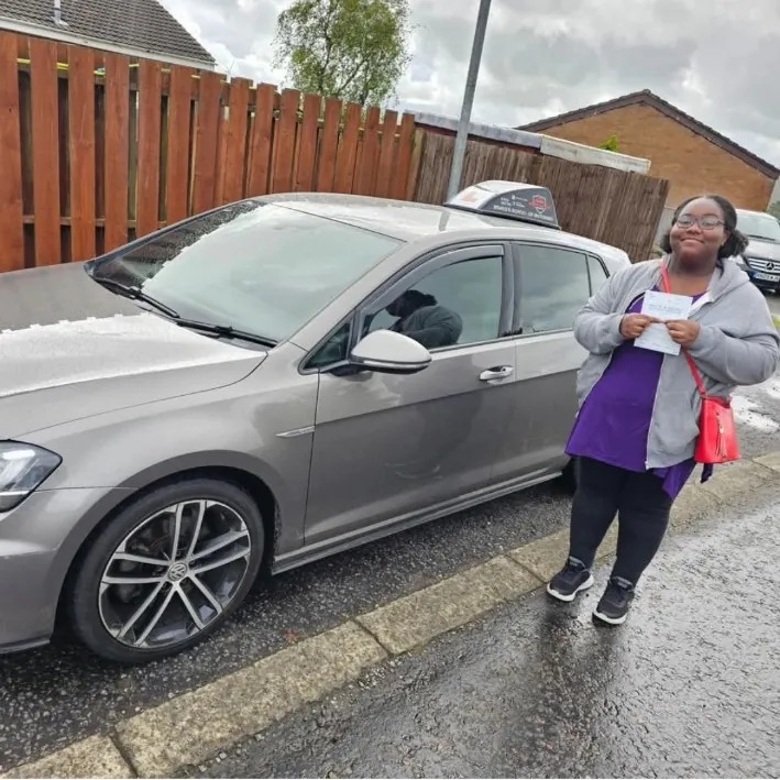 Lydia after a first-time driving test pass with Bravo's
